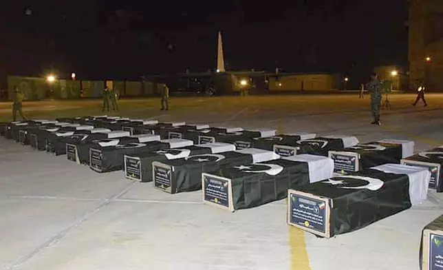 In this photo released by the Pakistan Air Force, bodies of Shiite Muslim pilgrims who were killed in a bus crash in Iran while heading to Iraq for a pilgrimage, arrive at an airbase in Jacobabad, Pakistan, Saturday, Aug. 24, 2024. (Pakistan Air Force via AP)