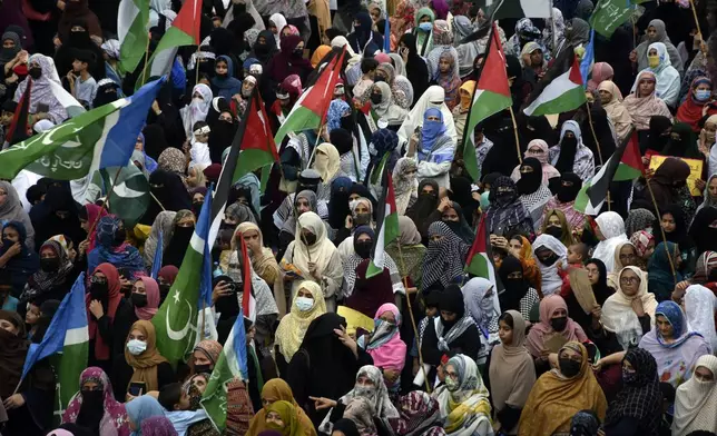 Supporters of the Pakistani religious group "Jamaat-e-Islami" take part in a rally against the Israeli airstrikes and to show solidarity with Palestinian people living in Gaza, in the city of Rawalpindi, Pakistan, Saturday, Aug. 3, 2024. (AP Photo/W.K. Yousafzai)