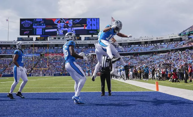 Carolina Panthers wide receiver Jalen Coker celebrates his touchdown in the second half of an NFL preseason football game against the Buffalo Bills, Saturday, Aug. 24, 2024, in Orchard Park, N.Y. (AP Photo/Charles Krupa)