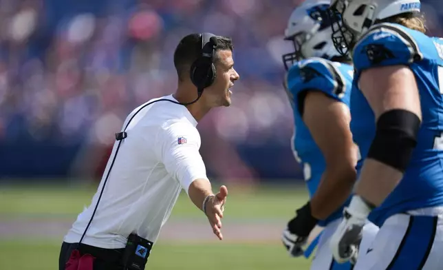 Carolina Panthers head coach Dave Canales talks to his team in the second half of an NFL preseason football game against the Buffalo Bills, Saturday, Aug. 24, 2024, in Orchard Park, N.Y. (AP Photo/Charles Krupa)