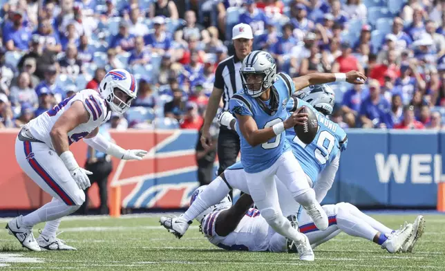 Carolina Panthers quarterback Bryce Young scrambles in the first half of an NFL preseason football game against the Buffalo Bills, Saturday, Aug. 24, 2024, in Orchard Park, N.Y. (AP Photo/Jeffrey T. Barnes)