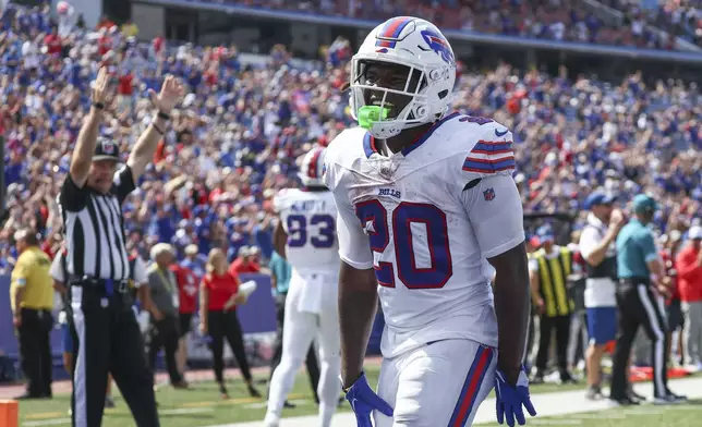 Buffalo Bills running back Frank Gore Jr. (20) celebrates his touchdown in the second half of an NFL preseason football game against the Carolina Panthers, Saturday, Aug. 24, 2024, in Orchard Park, N.Y. (AP Photo/Jeffrey T. Barnes)