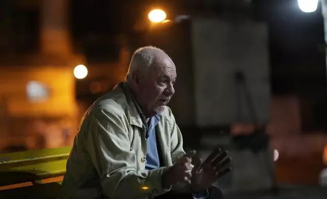 Rogelio Goiburú, an activist spearheading government and civil society efforts to recover victims' remains and seek justice for dictatorship-era crimes, talks during interview at the Plaza of the Disappeared in Asuncion, Paraguay, Wednesday, Aug. 14, 2024. (AP Photo/Jorge Saenz)