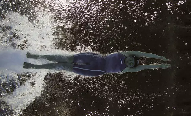 United States' McKenzie Coan competes to win the gold medal in the women's 100-meter freestyle S7 swimming event at the Paralympic Games in Rio de Janeiro, Brazil, Sept. 16, 2016. (AP Photo/Felipe Dana)