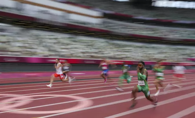 Brazil's Washington Junior leads the field in his heat of the men's 100-meters T47 at the 2020 Paralympics at the National Stadium in Tokyo, Aug. 27, 2021. (AP Photo/Emilio Morenatti)