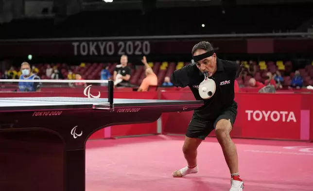 Ibrahim Hamadtou of Egypt plays against Park Hong-kyu of South Korea in Class 6, Group E of men's table tennis at the Tokyo Paralympic Games, Aug. 25, 2021, in Tokyo, Japan. (AP Photo/Eugene Hoshiko)