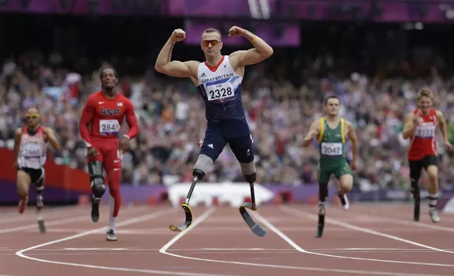 Britain's Richard Whitehead celebrates after winning the men's 200m T42 final race at the 2012 Paralympics in London, Sept. 1, 2012. (AP Photo/Lefteris Pitarakis)