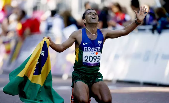 Gold medalist Brazil's Tito Sena reacts after winning the men's marathon T46 category at the 2012 Paralympics, Sept. 9, 2012, in London. (AP Photo/Matt Dunham)