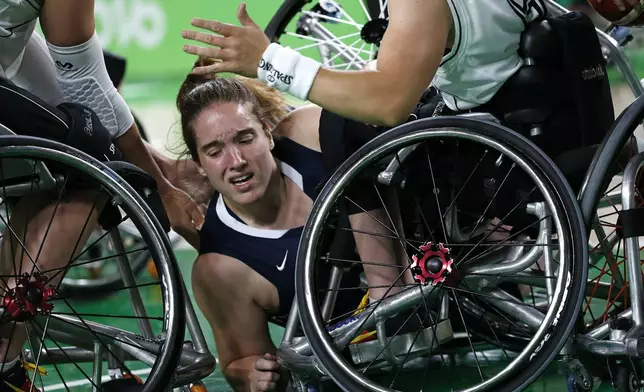 United States' Rebecca Murray falls during a women's gold medal wheelchair basketball game against Germany at the Paralympic Games in Rio de Janeiro, Brazil, Sept. 16, 2016. (AP Photo/Silvia Izquierdo)