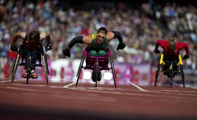 Austria's Rosemary Little, center, competes in a women's 100m T34 round 1 race at the Paralympics in London, Aug. 31, 2012. (AP Photo/Emilio Morenatti)