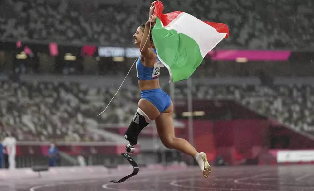 Italy's Ambra Sabatini celebrates after winning the women's T63 100-meters final at Tokyo 2020 Paralympic Games, Sept. 4, 2021, in Tokyo, Japan. (AP Photo/Emilio Morenatti)