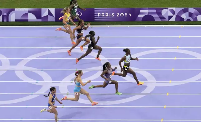 Julien Alfred, of Saint Lucia, leads the field in the second semifinal of the women's 100-meters at the 2024 Summer Olympics, Saturday, Aug. 3, 2024, in Saint-Denis, France. (AP Photo/Mark Baker)