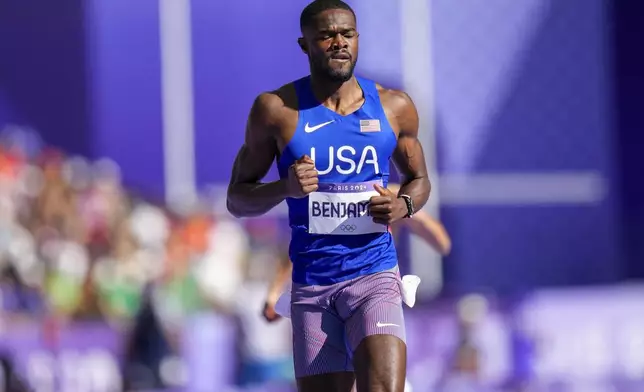 Rai Benjamin, of the United States, competes in the men's 400-meter hurdles heats at the 2024 Summer Olympics, Monday, Aug. 5, 2024, in Saint-Denis, France. (AP Photo/Petr David Josek)