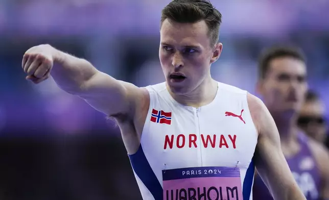 Karsten Warholm, of Norway, reacts after his men's 400-meter hurdles heat at the 2024 Summer Olympics, Monday, Aug. 5, 2024, in Saint-Denis, France. (AP Photo/Petr David Josek)