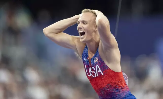 Sam Kendricks, of the United States, reacts after winning the silver medal in the men's pole vault at the 2024 Summer Olympics, Monday, Aug. 5, 2024, in Saint-Denis, France. (AP Photo/David Goldman)