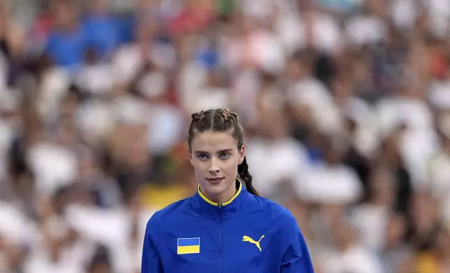 Yaroslava Mahuchikh, of Ukraine, prepares to compete in the women's high jump final at the 2024 Summer Olympics, Sunday, Aug. 4, 2024, in Saint-Denis, France. (AP Photo/Matthias Schrader)