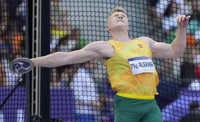 Mykolas Alekna, of Lithuania, competes during the men's discus throw qualification at the 2024 Summer Olympics, Monday, Aug. 5, 2024, in Saint-Denis, France. (AP Photo/Matthias Schrader)