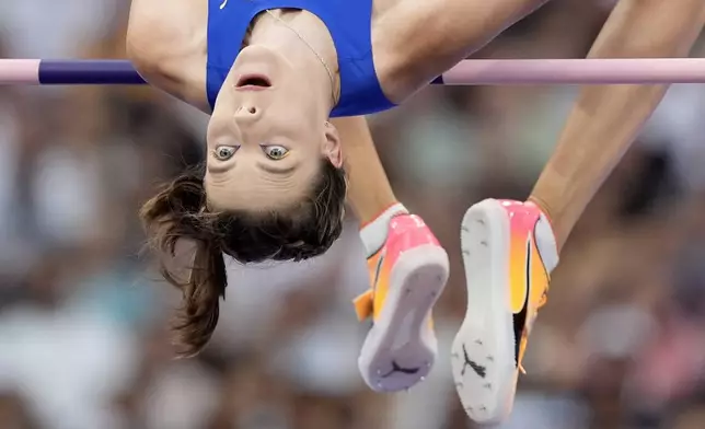 Yaroslava Mahuchikh, of Ukraine, competes in the women's high jump final at the 2024 Summer Olympics, Sunday, Aug. 4, 2024, in Saint-Denis, France. (AP Photo/Matthias Schrader)