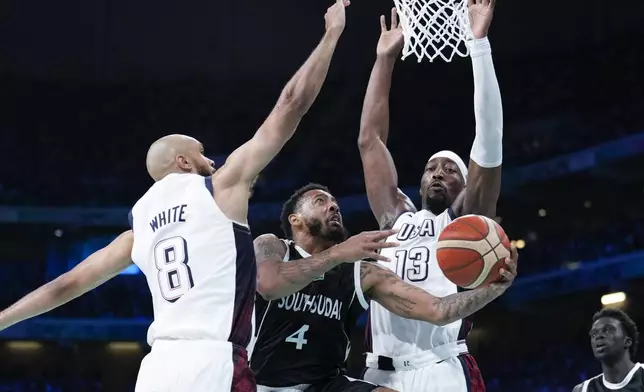 in a men's basketball game at the 2024 Summer Olympics, Wednesday, July 31, 2024, in Villeneuve-d'Ascq, France. (AP Photo/Mark J. Terrill)