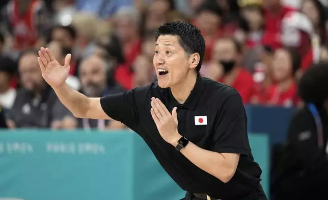 Japan head coach Toru Onzuka gestures during a women's basketball game against Germany at the 2024 Summer Olympics, Thursday, Aug. 1, 2024, in Villeneuve-d'Ascq, France. (AP Photo/Michael Conroy)