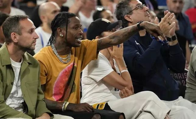 Travis Scott watches the France vs' Germany game during a men's semifinals basketball game at Bercy Arena at the 2024 Summer Olympics, Thursday, Aug. 8, 2024, in Paris, France. (AP Photo/Mark J. Terrill)