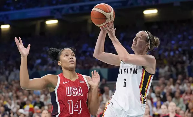 Belgium's Antonia Delaere, right, shoots as United States' Alyssa Thomas defends during a women's basketball game at the 2024 Summer Olympics, Thursday, Aug. 1, 2024, in Villeneuve-d'Ascq, France. (AP Photo/Michael Conroy)