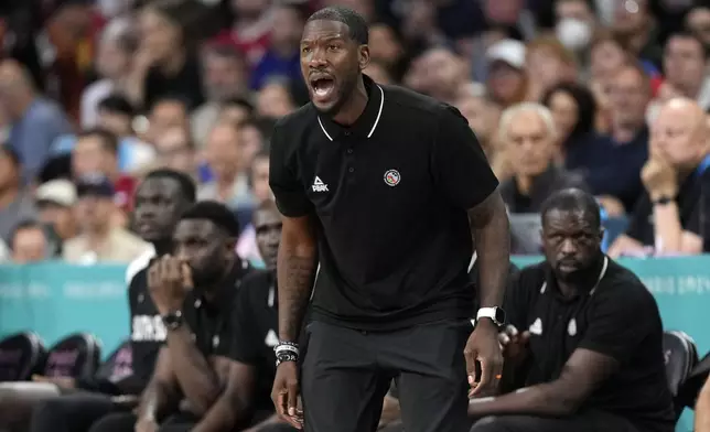 South Sudan head coach Royal Ivey yells to his team during a men's basketball game against Serbia at the 2024 Summer Olympics, Saturday, Aug. 3, 2024, in Villeneuve-d'Ascq, France. (AP Photo/Michael Conroy)