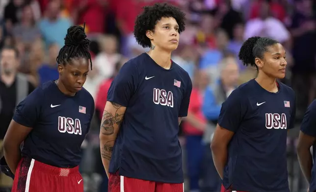 United States' Brittney Griner, center, stands on the court during the national anthem prior to a women's basketball game against Belgium at the 2024 Summer Olympics, Thursday, Aug. 1, 2024, in Villeneuve-d'Ascq, France. (AP Photo/Michael Conroy)