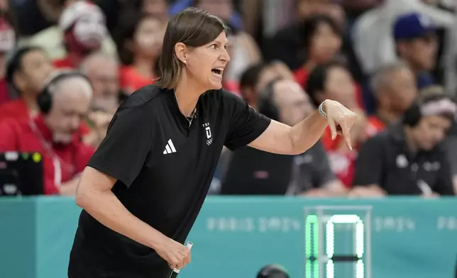 Germany head coach Lisa Thomaidis gestures during a women's basketball game at the 2024 Summer Olympics, Thursday, Aug. 1, 2024, in Villeneuve-d'Ascq, France. (AP Photo/Michael Conroy)