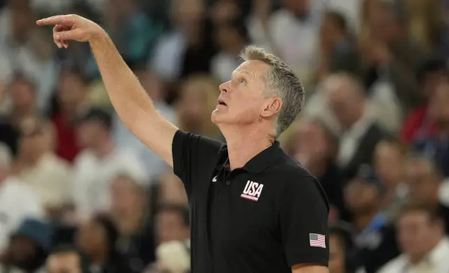 Steve Kerr, coach for the United States gestures during a men's semifinals basketball game against Serbia at Bercy Arena at the 2024 Summer Olympics, Thursday, Aug. 8, 2024, in Paris, France. (AP Photo/Mark J. Terrill)