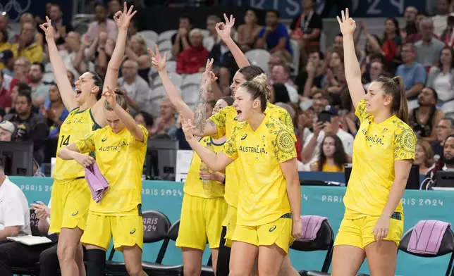 Members of the Australia team celebrate from the bench after Australia scored during a women's basketball game against Canada at the 2024 Summer Olympics, Thursday, Aug. 1, 2024, in Villeneuve-d'Ascq, France. (AP Photo/Michael Conroy)