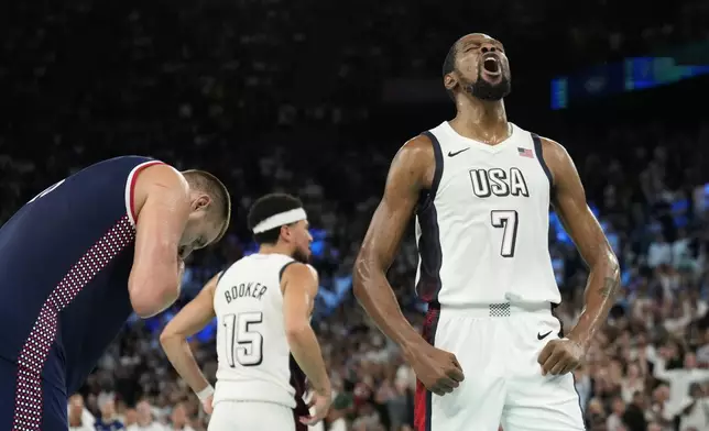 United States' Kevin Durant (7) celebrates a basket in the final minutes against Serbia during a men's semifinals basketball game at Bercy Arena at the 2024 Summer Olympics, Thursday, Aug. 8, 2024, in Paris, France. (AP Photo/Mark J. Terrill)