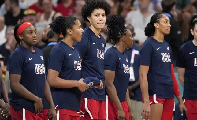 United States' Brittney Griner, center, stands on the court prior to a women's basketball game against Belgium at the 2024 Summer Olympics, Thursday, Aug. 1, 2024, in Villeneuve-d'Ascq, France. (AP Photo/Michael Conroy)