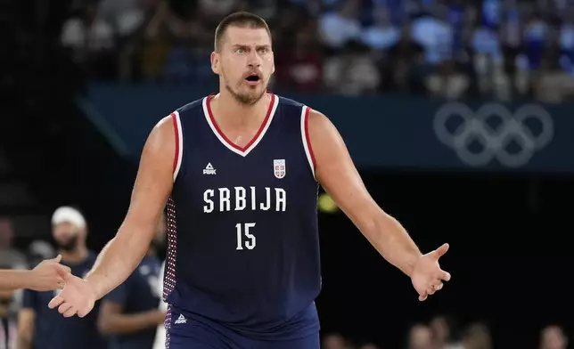 Nikola Jokic (15), of Serbia argues a call against the United States during a men's semifinals basketball game at Bercy Arena at the 2024 Summer Olympics, Thursday, Aug. 8, 2024, in Paris, France. (AP Photo/Michael Conroy)