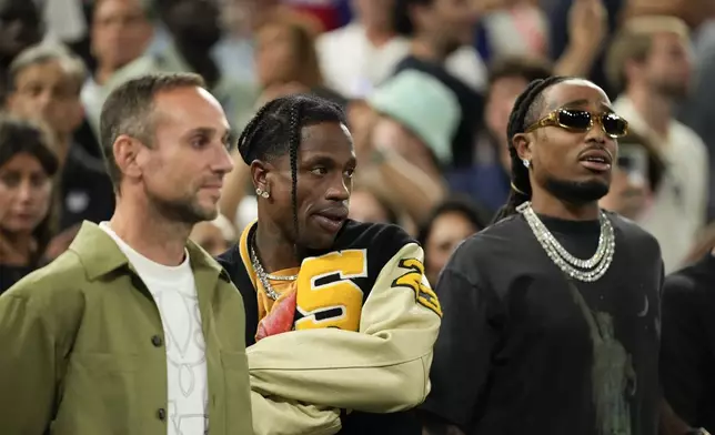 Travis Scott watches the Serbia vs' United States game during a men's semifinals basketball game at Bercy Arena at the 2024 Summer Olympics, Thursday, Aug. 8, 2024, in Paris, France. (AP Photo/Mark J. Terrill)