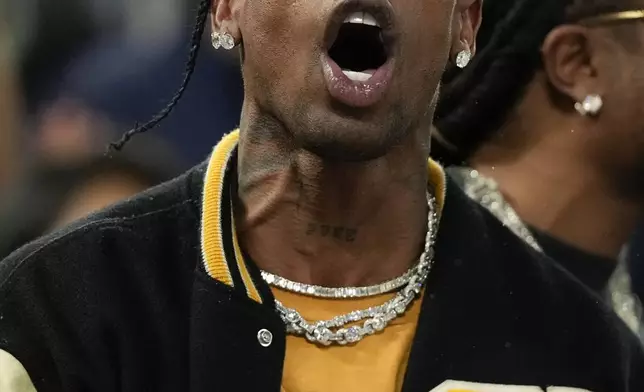 Travis Scott watches the Serbia vs' United States game during a men's semifinals basketball game at Bercy Arena at the 2024 Summer Olympics, Thursday, Aug. 8, 2024, in Paris, France. (AP Photo/Mark J. Terrill)