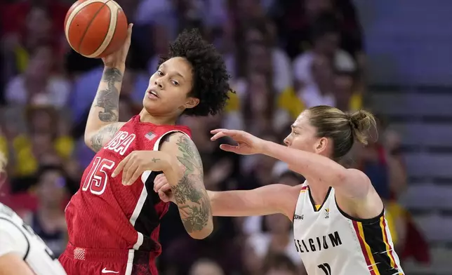 United States' Brittney Griner, left, pushes toward the basket as Belgium's Emma Meesseman defends during a women's basketball game at the 2024 Summer Olympics, Thursday, Aug. 1, 2024, in Villeneuve-d'Ascq, France. (AP Photo/Michael Conroy)