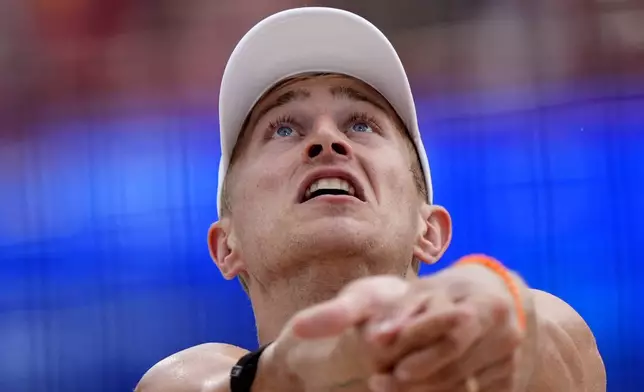 The Netherland's Steven van de Velde gets set to return a shot against Chile in a beach volleyball match at the 2024 Summer Olympics, Wednesday, July 31, 2024, in Paris, France. (AP Photo/Robert F. Bukaty)