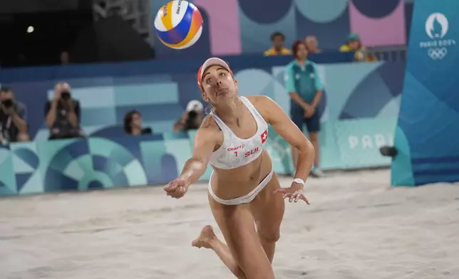 Switzerland's Tanja Hueberli returns a shot in the women's beach volleyball bronze medal match between Australia and Switzerland, at the 2024 Summer Olympics, Friday, Aug. 9, 2024, in Paris, France. (AP Photo/Robert F. Bukaty)