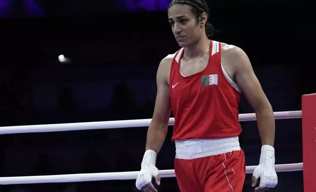 Algeria's Imane Khelif, reacts after defeating Italy's Angela Carini in their women's 66kg preliminary boxing match at the 2024 Summer Olympics, Thursday, Aug. 1, 2024, in Paris, France. (AP Photo/John Locher)