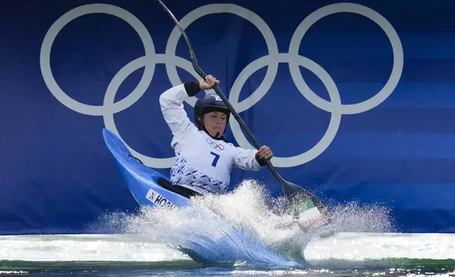 Stefanie Horn of Italy competes in the women's kayak cross time trial at the 2024 Summer Olympics, Friday, Aug. 2, 2024, in Vaires-sur-Marne, France. (AP Photo/Kirsty Wigglesworth)