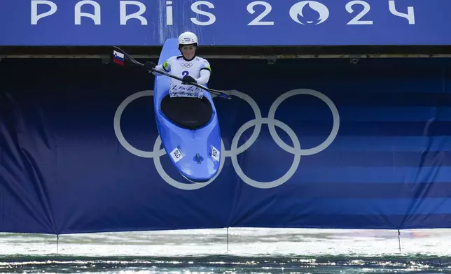 Eva Tercelj of Slovenia competes in the women's kayak cross time trial at the 2024 Summer Olympics, Friday, Aug. 2, 2024, in Vaires-sur-Marne, France. (AP Photo/Kirsty Wigglesworth)