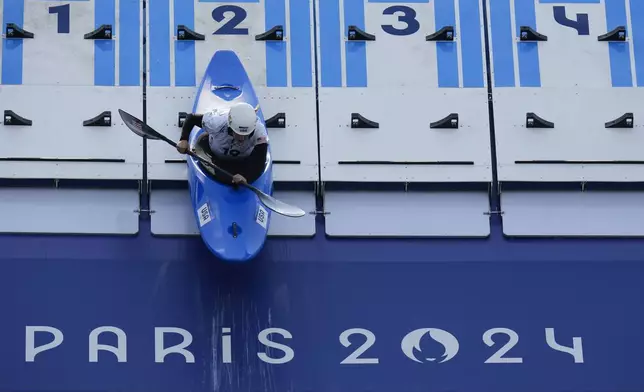 Evy Leibfarth of the United States competes in the women's kayak cross time trial at the 2024 Summer Olympics, Friday, Aug. 2, 2024, in Vaires-sur-Marne, France. (AP Photo/Kirsty Wigglesworth)