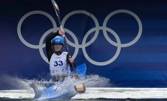 Madison Corcoran of Ireland competes in the women's kayak cross time trial at the 2024 Summer Olympics, Friday, Aug. 2, 2024, in Vaires-sur-Marne, France. (AP Photo/Kirsty Wigglesworth)