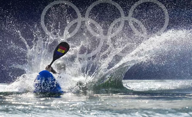 Monica Doria Vilarrubla of Andorra competes in the women's kayak cross time trial at the 2024 Summer Olympics, Friday, Aug. 2, 2024, in Vaires-sur-Marne, France. (AP Photo/Kirsty Wigglesworth)