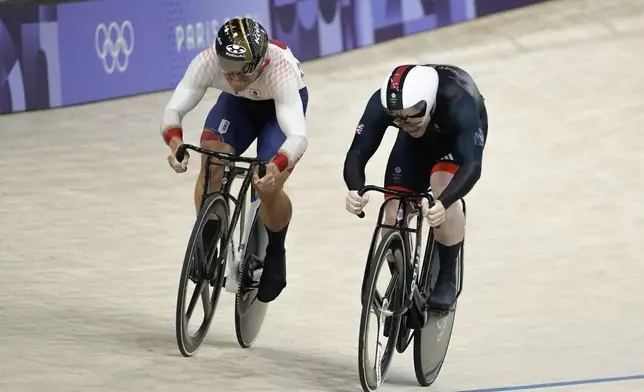 Kaiya Ota of Japan competes alongside Jack Carlin of Britain, right, during the men's sprint event, at the Summer Olympics, Thursday, Aug. 8, 2024, in Paris, France. (AP Photo/Ricardo Mazalan)