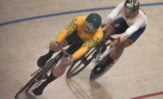 Australia's Matthew Richardson, left, leads Japan's Yuta Obara during the men's sprint event, at the Summer Olympics, Thursday, Aug. 8, 2024, in Paris, France. (AP Photo/Thibault Camus)