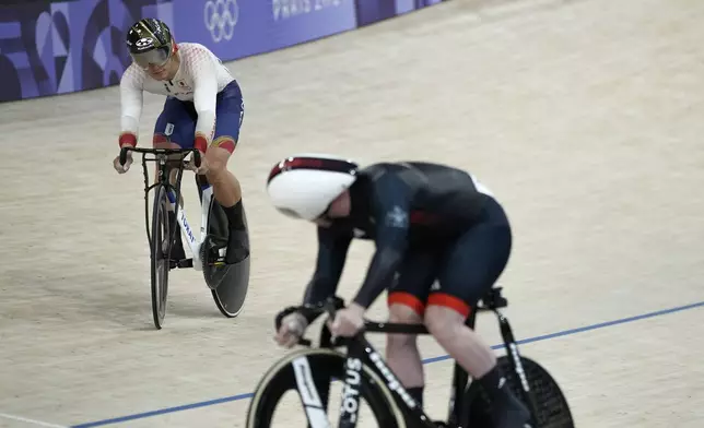 Kaiya Ota of Japan competes alongside Jack Carlin of Britain, bottom, during the men's sprint event, at the Summer Olympics, Thursday, Aug. 8, 2024, in Paris, France. (AP Photo/Ricardo Mazalan)
