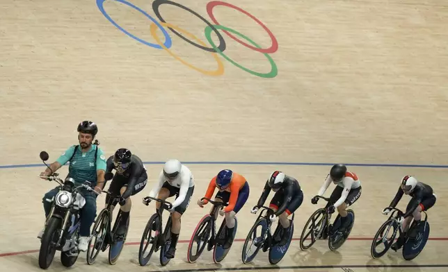 Competitors race during the women's keirin final, at the Summer Olympics, Thursday, Aug. 8, 2024, in Paris, France. (AP Photo/Ricardo Mazalan)