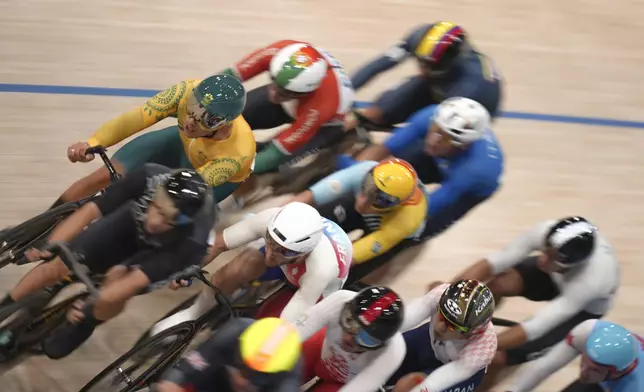 Competitors take part in the men's omnium event, at the Summer Olympics, Thursday, Aug. 8, 2024, in Paris, France. (AP Photo/Thibault Camus)